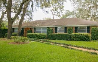 Lake front living in Longwood. Huge home on large lot full of trees and mature landscaping.