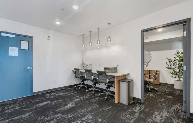 a conference room with a table and chairs and a blue door