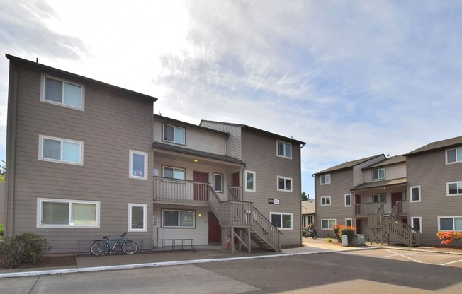 a row of apartments with balconies and a street