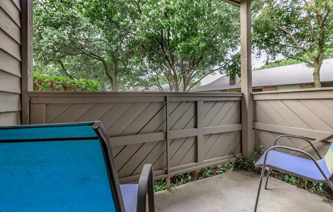 furnished patio with blue chairs
