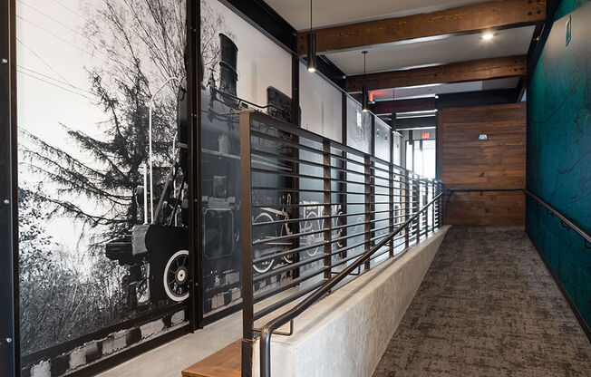 a large black and white photo of an old locomotive is displayed on the wall of the at 1001 NP, Fargo, North Dakota 58102