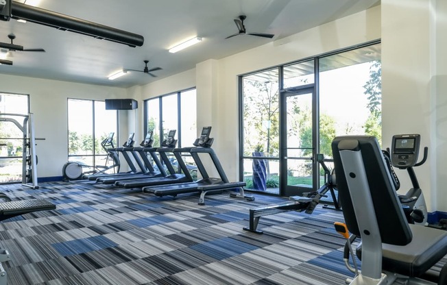 fitness center at Reveal on the Lake apartments