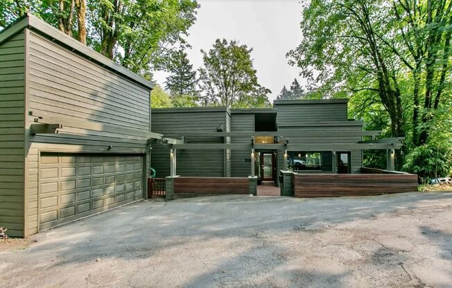 Stunning Contemporary Architectural Gem Near NW 23rd in the Coveted West Hills Arlington Heights Neighborhood!