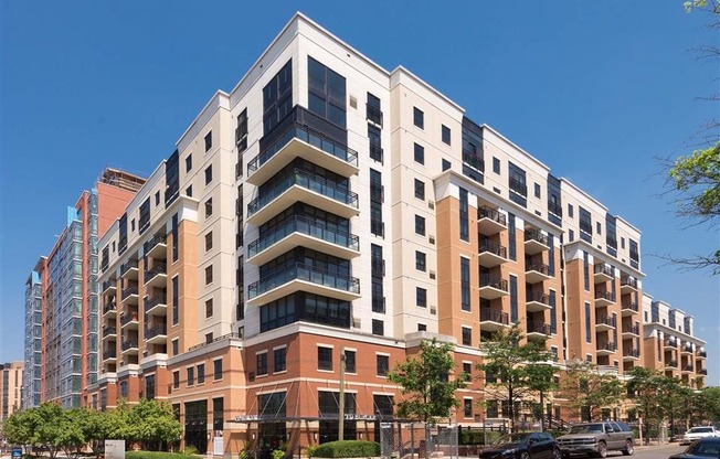 an apartment building on the corner of a city street