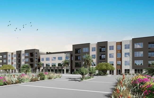 A modern apartment complex with a driveway in front at Refinery at Pointe17 Apartments, Phoenix, Arizona