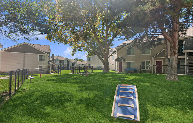 Community Dog Park with Agility Equipment at Broadmoor Village Apartments located in West Jordan, UT.