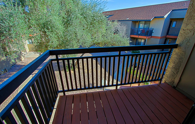 a balcony or terrace at the club at evergreen apartments