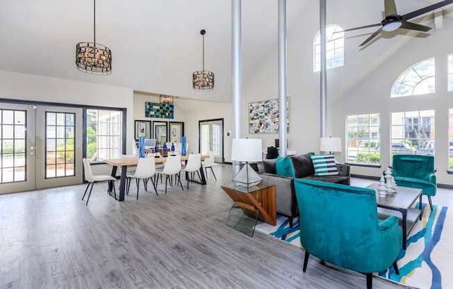 a living room and dining room with a table and chairs at The Davis Apartments, Huntsville, 35816  