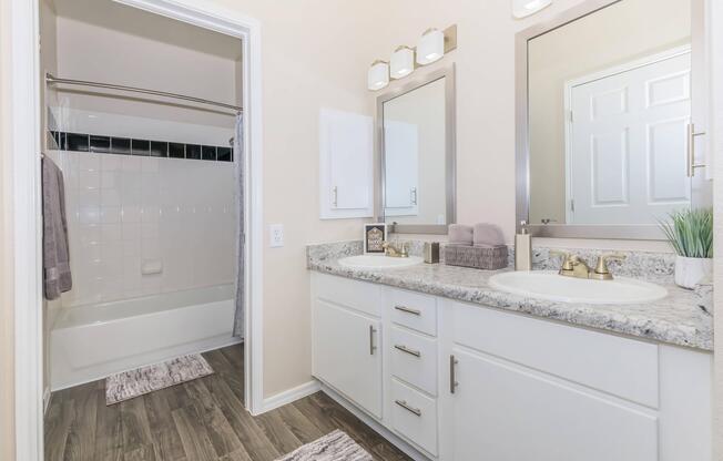 a kitchen with a sink and a mirror