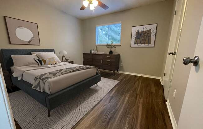 a bedroom with a bed and a ceiling fan at The Junction, Tennessee