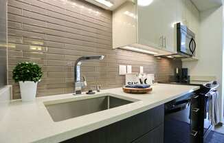 a kitchen with a sink and a stove