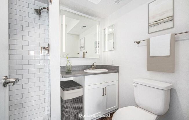 a bathroom with a walk in shower at The Crossings Apartments, Michigan, 49508