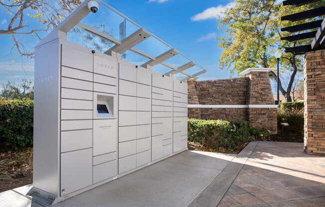 A LUXER solar panel is installed on a white wall.