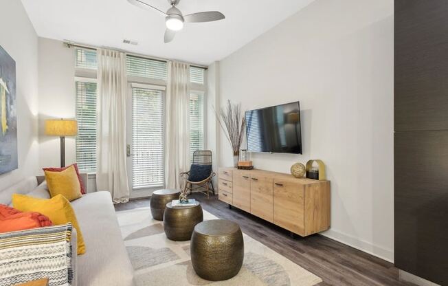 a living room with a couch and a tv