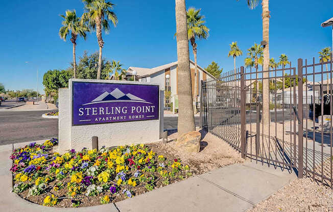 A Sterling Point Apartment Homes sign is in front of a gated community at Sterling Point Apartment Homes, Phoenix, Arizona