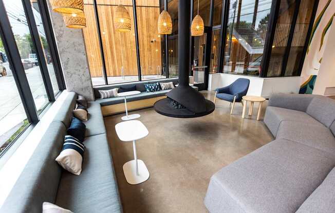 a living room with couches and chairs and a fireplace