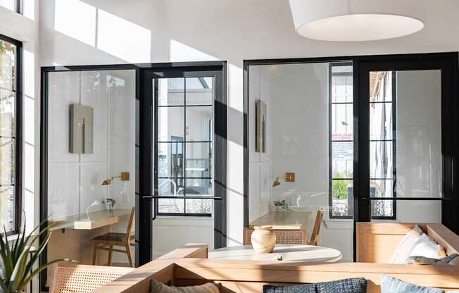 A modern dining area with a table set for two.
