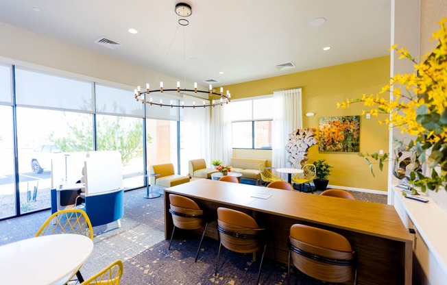 a dining room with a long wooden table and chairs