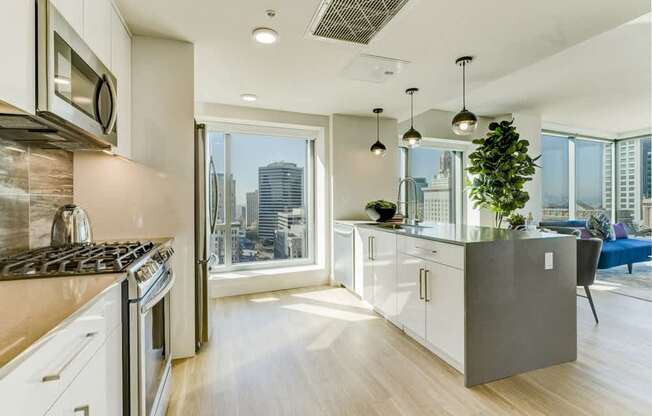 A modern kitchen with a view of the city.