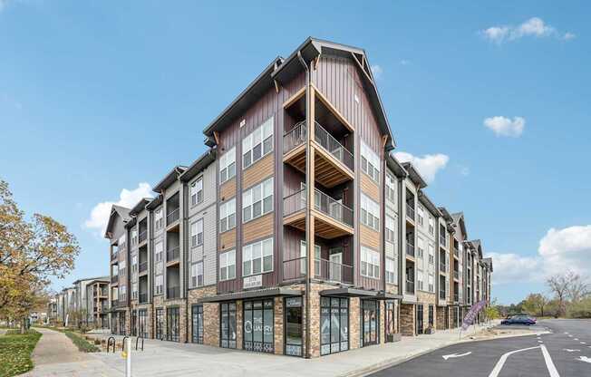 a building with balconies on the side of a street at The Quarry Luxury Apartment Homes, Fort Collins, CO, 80526
