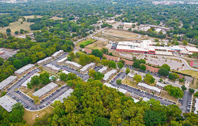 an aerial view of a city with buildings and trees