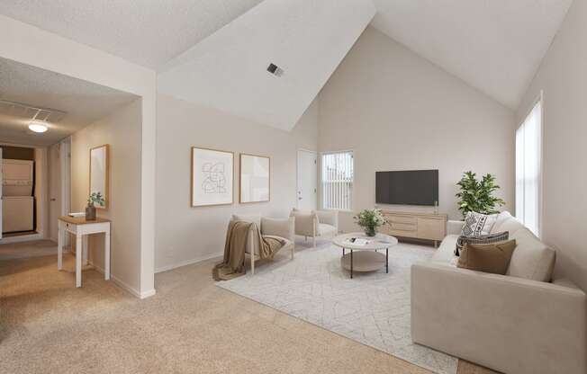 the living room of an apartment with a couch and a tv at Vineyard Terrace Apartments, Napa, CA