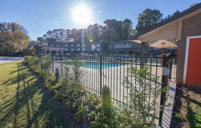 a pool with a fence in front of a building at Broadway at East Atlanta, Atlanta, Georgia