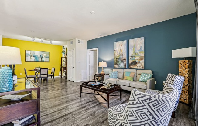 A living room with a patterned chair and a coffee table.