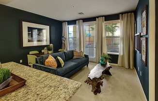 San Jose Apartments for Rent- Aviara - Wall-to-Wall Carpeting, Blue Couch, Floor-to-Ceiling Windows, and Wall art