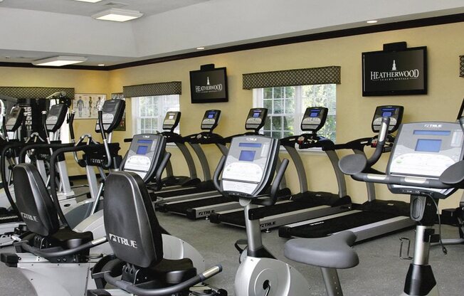 exercise bikes in a gym, tv's on the wall at Lakeside Village, East Patchogue, 11772