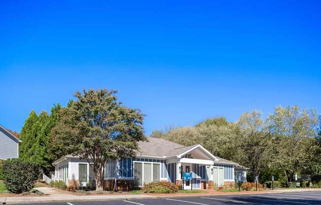 A building with a parking lot in front of it.