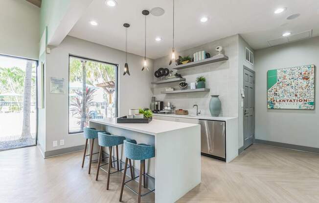 Kitchen with an island and stools in front of a white counter top