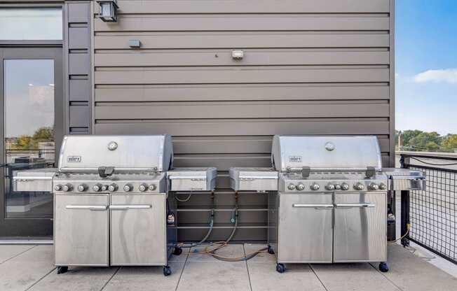 two stainless steel gas grills in front of a building at Barrington 101, Barrington, IL 60010