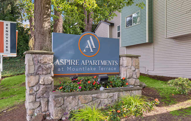 A sign for Aspire Apartments at Mountlake Terrace is shown.