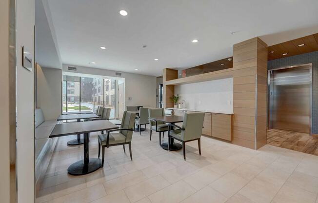 a dining room with tables and chairs and a counter