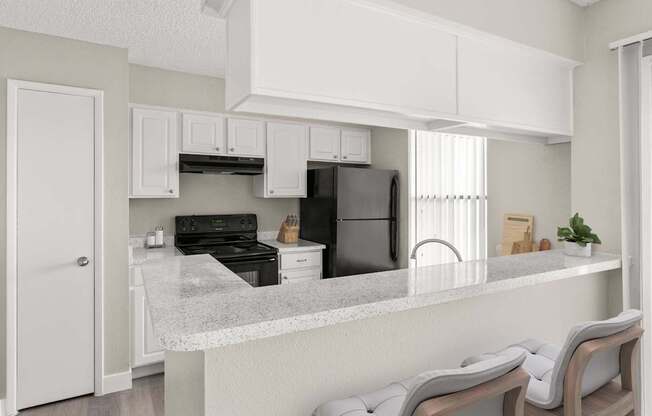 A kitchen with a refrigerator, oven, and stove.