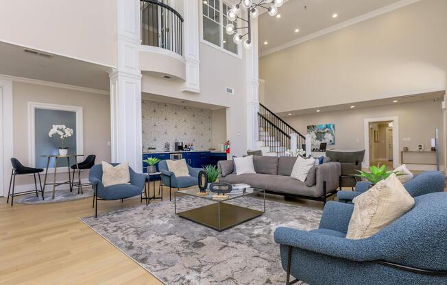 a living room filled with furniture and a large window