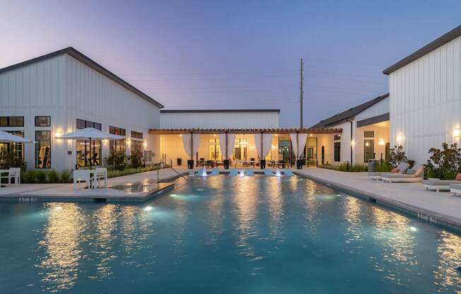 a house with a swimming pool in front of it