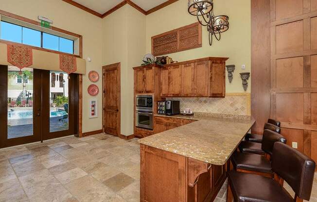 a kitchen with a counter top next to a doorway  at Hacienda Club, Jacksonville, FL, 32256