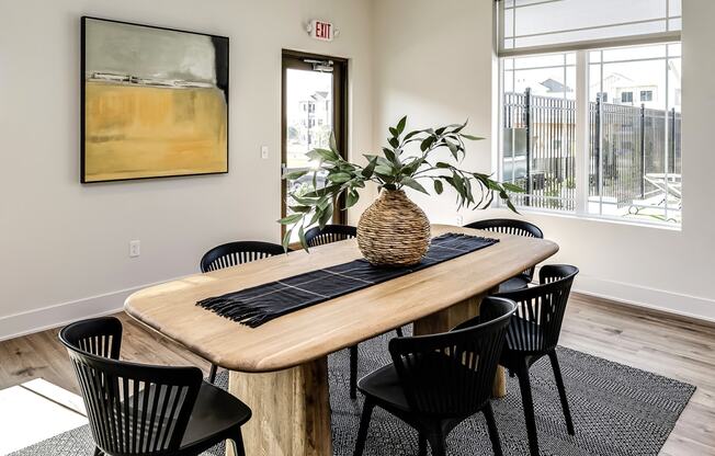 Clubhouse dining area with large window at Hanover Flats in Bennington, NE