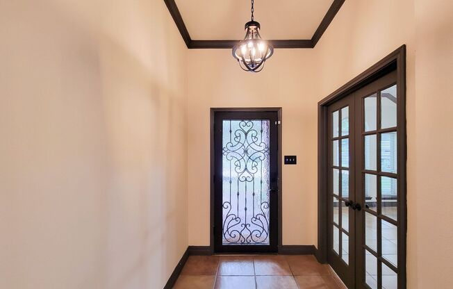 Custom glass and wrought iron front door welcomes you into this recently remodeled home. Italian tile throughout the home, custom fireplace, completely remodeled kitchen with granite countertops, and new appliances. The primary bath and closet have custo