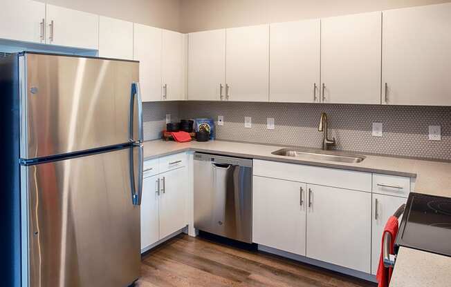 Kitchen with Appliances and White Cabinets