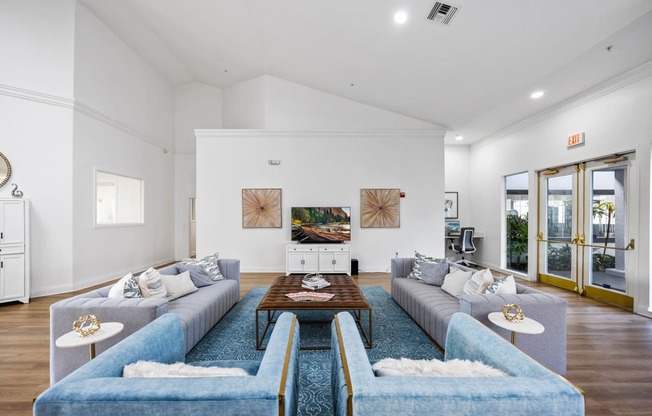 a living room with couches and a coffee table