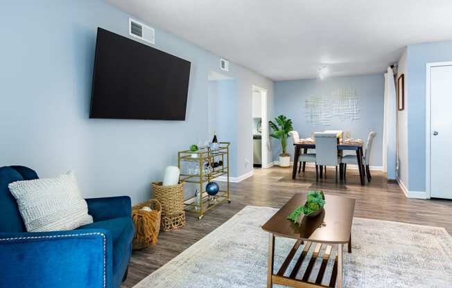 a living room with a couch and a table and a tv