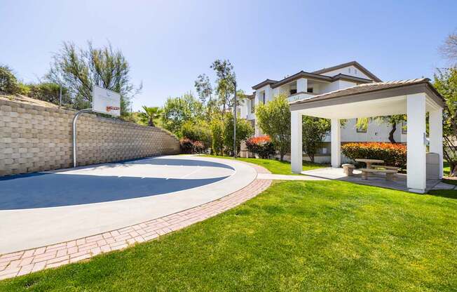 A house with a pool and a gazebo in the backyard.