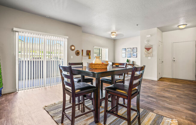 a dining room with a table and chairs