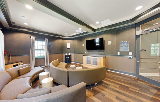 Media room with TV and ample seating at Fenwyck Manor