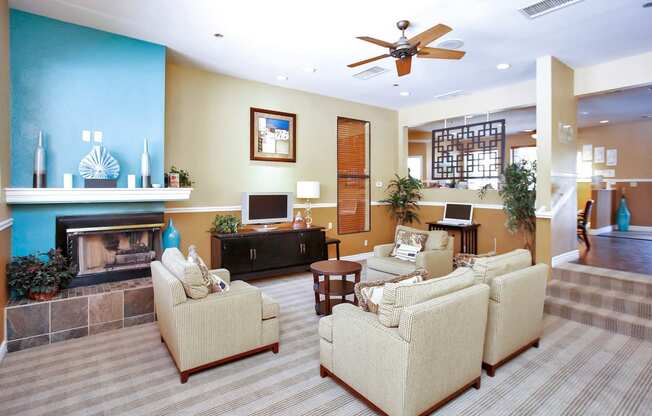 a living room with furniture and a fireplace