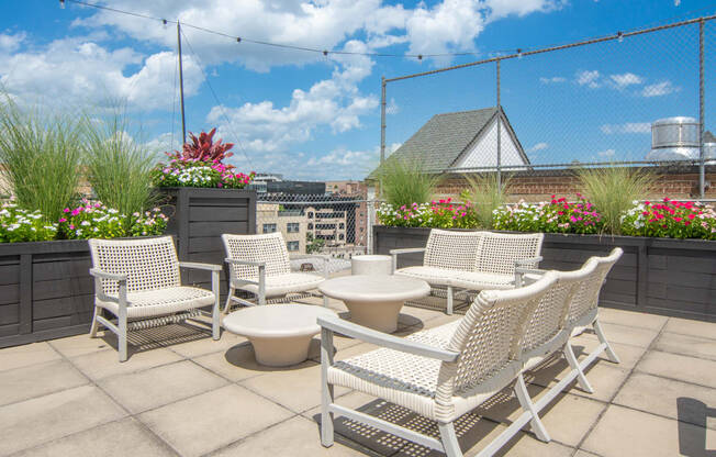 the patio on the roof of the building has a view of the city