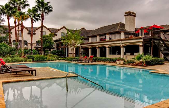 a swimming pool with a building in the background